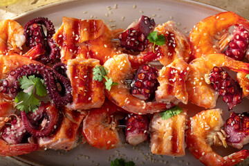Hot grilled skewer with coriander, lime and sesame.