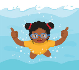 Little African girl swimming diving underwater in the pool showing thumb up
