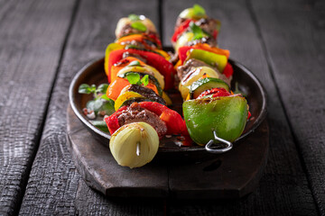 Tasty roasted skewer with vegetables and beef.