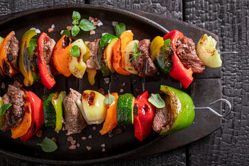 Hot grilled skewer as summer delicacy in sunny day.