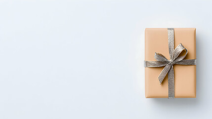 Minimalist beige gift box with silver ribbon on white background