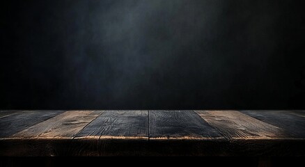 Empty wooden table with a dark background
