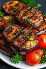 Colorful grilled mixed vegetables featuring eggplant, onions, and cherry tomatoes perfect for outdoor BBQ gatherings
