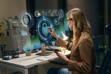 Professional Woman Analyzing Network Cybersecurity Data on Futuristic Digital Display at Work