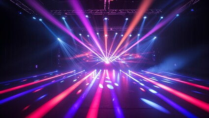Colorful stage lights illuminate an event space during a live performance in a vibrant atmosphere