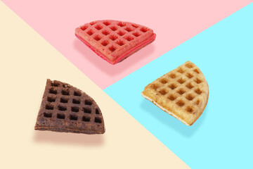 Colorful Waffle Trio on Pastel Background – Chocolate, Strawberry, and Vanilla Flavored Waffles
