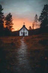 Rustic white country chapel at sunset with forest backdrop. Path leading to church door. Peaceful rural Christian scene for religious holidays, weddings, or spiritual reflection