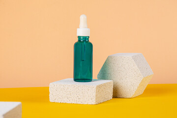 Cosmetic product in tube, bottle, lotion or serum with stylish props on cream background. 