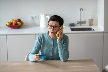 Scared confused naive woman transferring money from accounts to scammers over phone. Fraud financial manipulation, personal data theft, phone scam, vulnerable target, criminal activity, distress