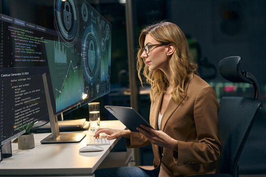 Professional Woman Monitoring Cybersecurity Data In High-Tech Office With Advanced Technology Screens