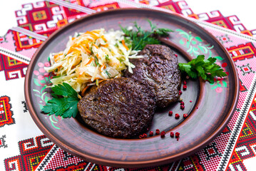 Ukrainian Cutlets with Fresh Coleslaw on Embroidered Tablecloth