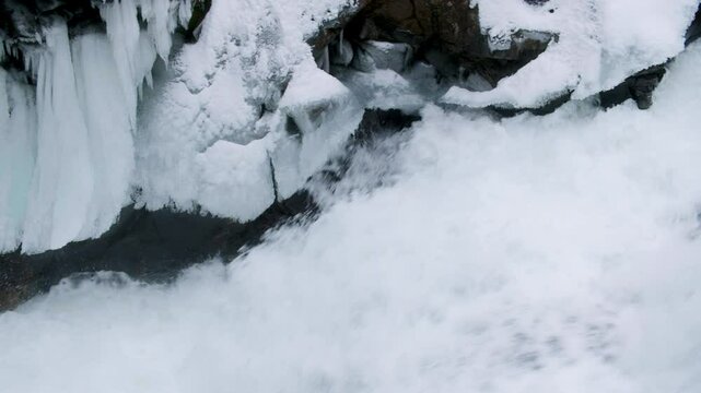 Raging Deception Falls Waterfall with Winter Icicles