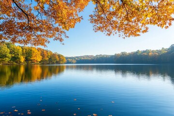 Serene Autumn Lake Scenery: Golden Leaves Reflect on Calm Water