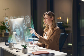 Professional Woman Analyzing Digital Interface Technology In Modern Office, Cybersecurity Concept