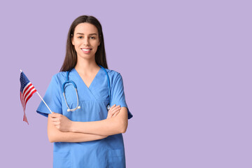 Female doctor with USA flag on lilac background