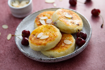 Banana cottage cheese cakes with cherries and almond