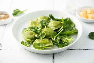 Homemade spinach ravioli with parmesan cheese