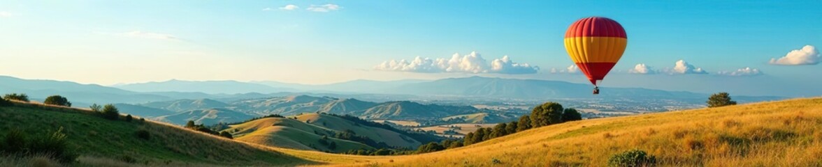 A stunning landscape of rolling hills and colorful fields stretches out beneath a vivid blue sky as a hot air balloon floats gracefully above,  journey,  tranquility