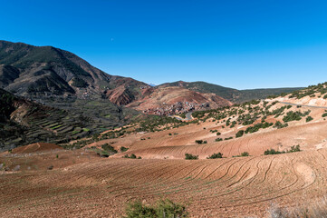 Discovering the Majestic Atlas Mountains in Morocco with Terraced Fields and Clear Sky
