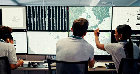 Screen, people and meteorology with weather for broadcast, satellite maps or teamwork to track storm. Control room, back or scientists with monitor for forecast news, pattern review or climate change