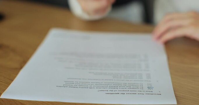 Student write educational test english exam studying in university. Education and knowledge assessment concept.