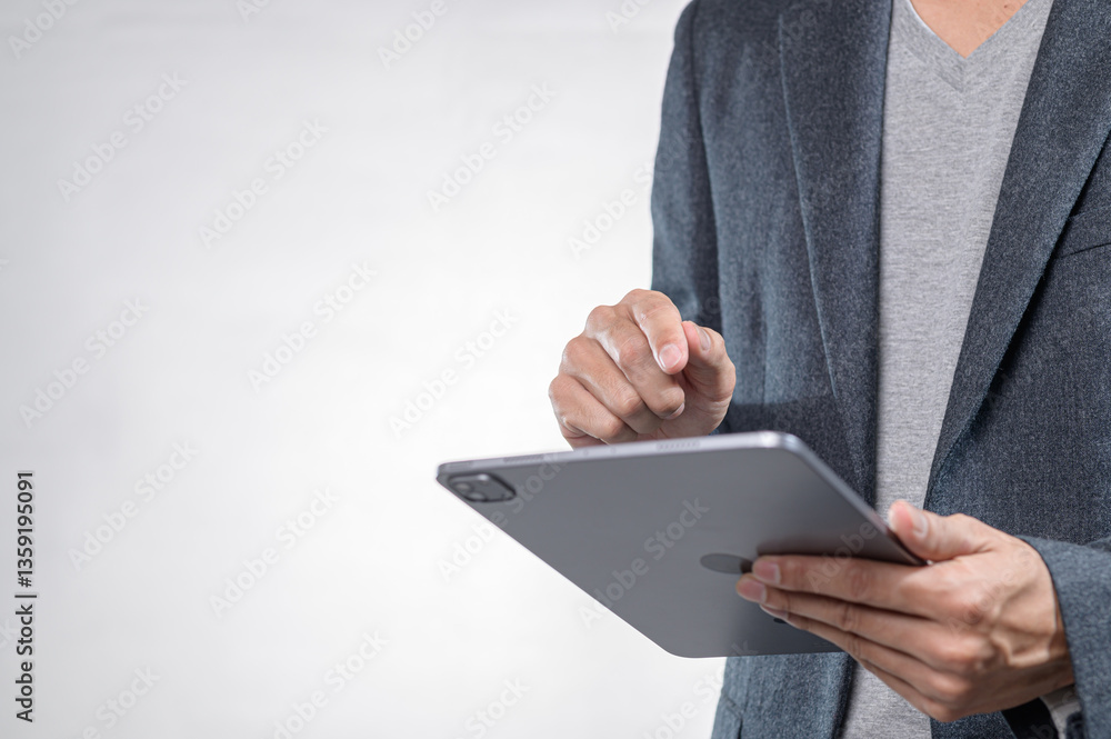 Poster professional man using tablet device in modern business setting