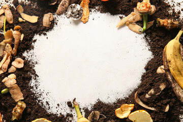Frame made from organic waste and soil on white grunge background. Compost recycling concept