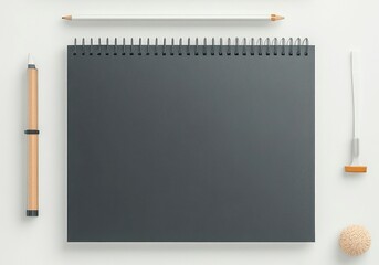 Obraz premium Blank dark gray notebook, pencils, and accessories on white surface