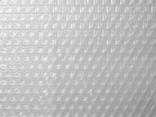 Fototapeta premium plastic bubble wrap texture for background. Plastic material with air for packing and protecting products from bumps and scratches.