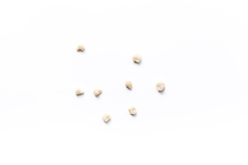 Dental teeth crowns for dental prosthetics, top view. Dentist desk, white background