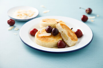 Banana cottage cheese cakes with cherries and almond