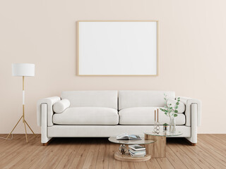 Obraz premium Cozy living room with a white sofa, coffee table, and blank frame