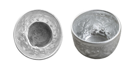 Two ornate Thai-style silver bowls with floral carvings, commonly used in ceremonies and festivals, isolated on white background