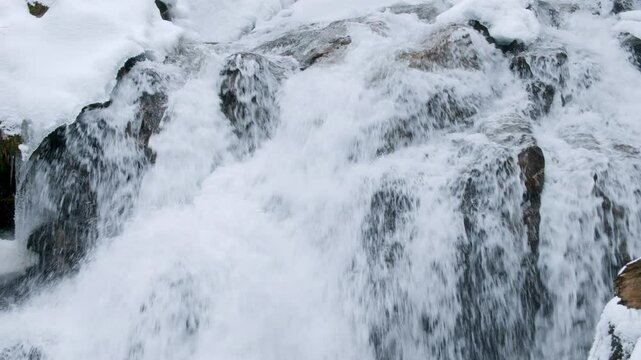 Spring Snow Melt Cascading Over Rocks at Deception Falls