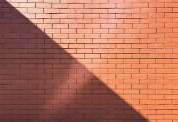A high-resolution image of a rustic red brick wall. 