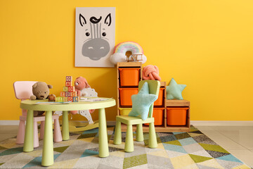 Interior of stylish playroom with toys in kindergarten