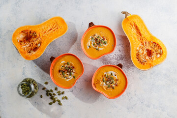 Traditional autumn butternut squash soup with seeds.