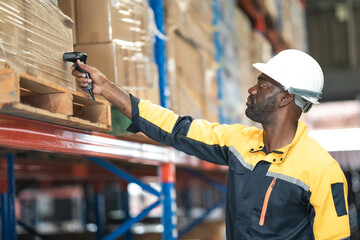 African American employee holding tablet, using barcode scanner working in warehouse, worker in yellow collar pointing and checking product on shelf in logistic industry.