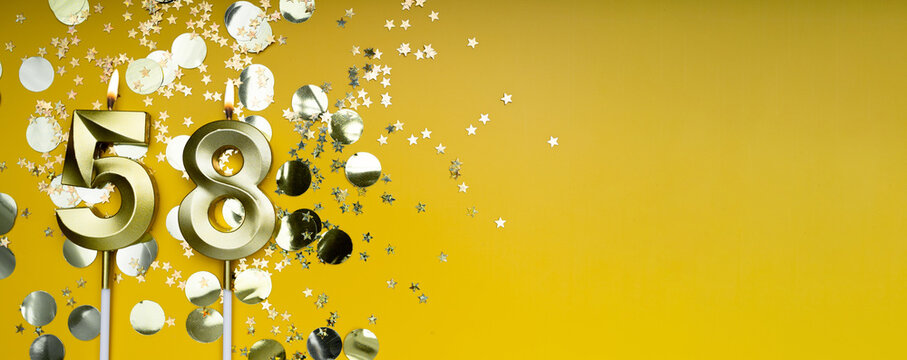 Golden candle number fifty-eight on yellow background. Birthday card with lettering 58. Anniversary concept. For birthday, new year celebration. Banner