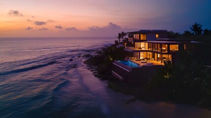 Beachfront villa with striking modern architecture, infinity pool and terraces blending seamlessly into the ocean horizon
