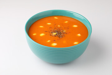 tomato soup with sweet corn on white background