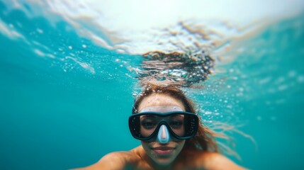 Naklejka premium Underwater snorkeling adventure in crystal clear tropical waters capturing the essence of marine exploration and aquatic beauty