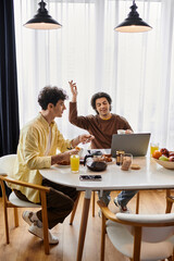Fototapeta premium Two men enjoying a meal and conversation in their modern apartment