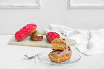 Sweet eclairs on light  background