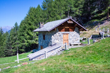 Mountain huts photographed in the Valtellina pastures near Bormio