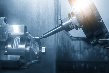 The 5-axis CNC milling machine multi-tasking type finish cutting the automotive part with solid ball nose end mill tool.