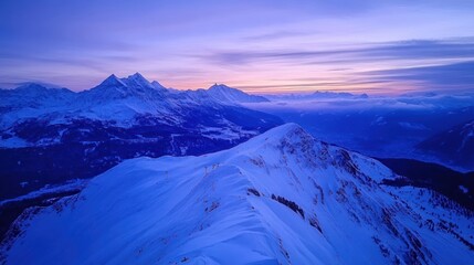 A serene winter landscape at twilight, showcasing snow-covered mountains and a tranquil sky.