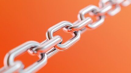 Obraz premium A close-up of a shiny metal chain against an orange background, highlighting the links and their reflective surfaces.