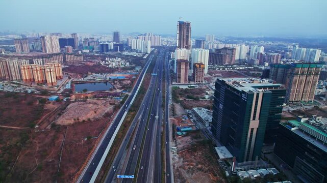 aerial view of financial district with Kokapet and outer ring road at Exit No 1, nanakramguda, hyderabad, telangana, india. day time, push in, drone shot, 4k.