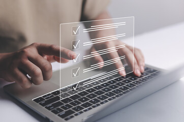 Business Performance Checklist Businessman Using Laptop Doing Online Checklist Survey On Computer Filling Out Digital Form Checklist Survey Doing Assessment Questionnaire Evaluation	
